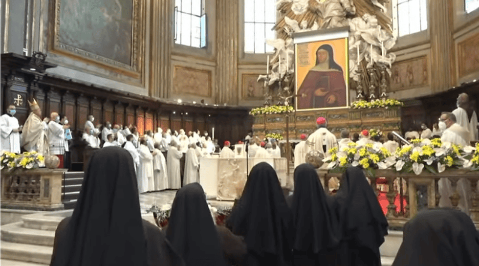 An icon of Blessed Maria Lorenza Longo is unveiled during her beatification in the Naples cathedral on Oct. 9.