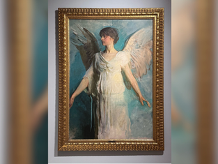 Framed painting of a woman with one dark and one light wing in a white dress, hanging on a gray museum wall.