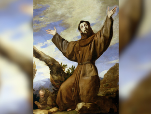 Brown-robed saint with arms raised in prayer on rocky mountainside, with a monk reading below under a cloudy sky.