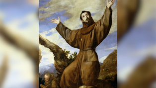 Brown-robed saint with arms raised in prayer on rocky mountainside, with a monk reading below under a cloudy sky.