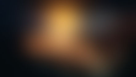 Three fingertips cradle a glowing orange galaxy with small planets against a dark, starry space backdrop.