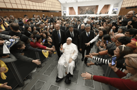 Faithful reach out to greet Pope Francis as he makes his way through the crowd in the Vatican’s Paul VI Audience Hall during the first jubilee audience of 2025. (Photo: Vatican Media)