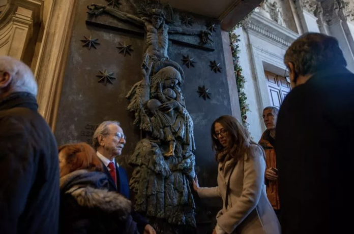 The faithful pass through the Holy Door of St. John Lateran on Dec. 29, 2024, in Rome. (Photo: Daniel Ibáñez/EWTN News)