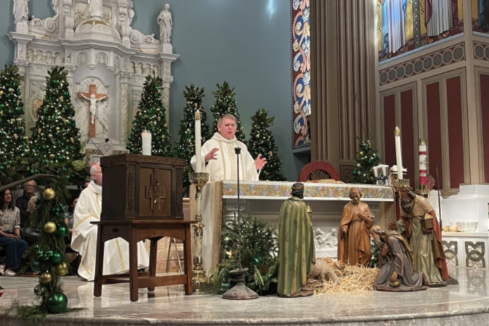 From left to right: Auxiliary Bishop of the Our Lady of the Angels Pastoral Region Matthew G. Elshoff, St. Monica pastor Father Lloyd Torgerson, and Corpus Christi pastor Monsignor Liam Kidney celebrate Mass at St. Monica Church with Corpus Christi’s surviving tabernacle next to the altar on Jan. 12, 2025. (Photo: Paul Escala)