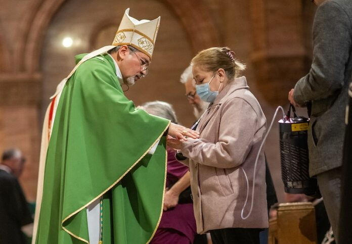 DENVER, CO - FEBRUARY 9: Denver Auxiliary Bishop Jorge Rodriguez gives the sacrament of the anointing of the sick during a World Day of the Sick Mass at Holy Ghost Catholic Church on February 9, 2025, in Denver, Colorado. (Photo by Daniel Petty/Denver Catholic)