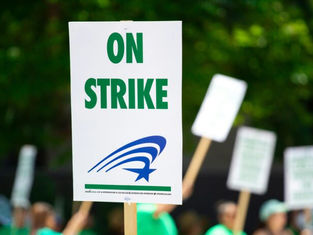 What does the Catholic Church teach about labor unions and strikes?