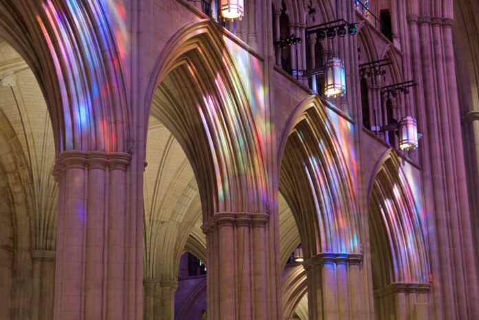 A white sun symbolizing the Holy Spirit against a blue to yellow gradient, representing hope.
