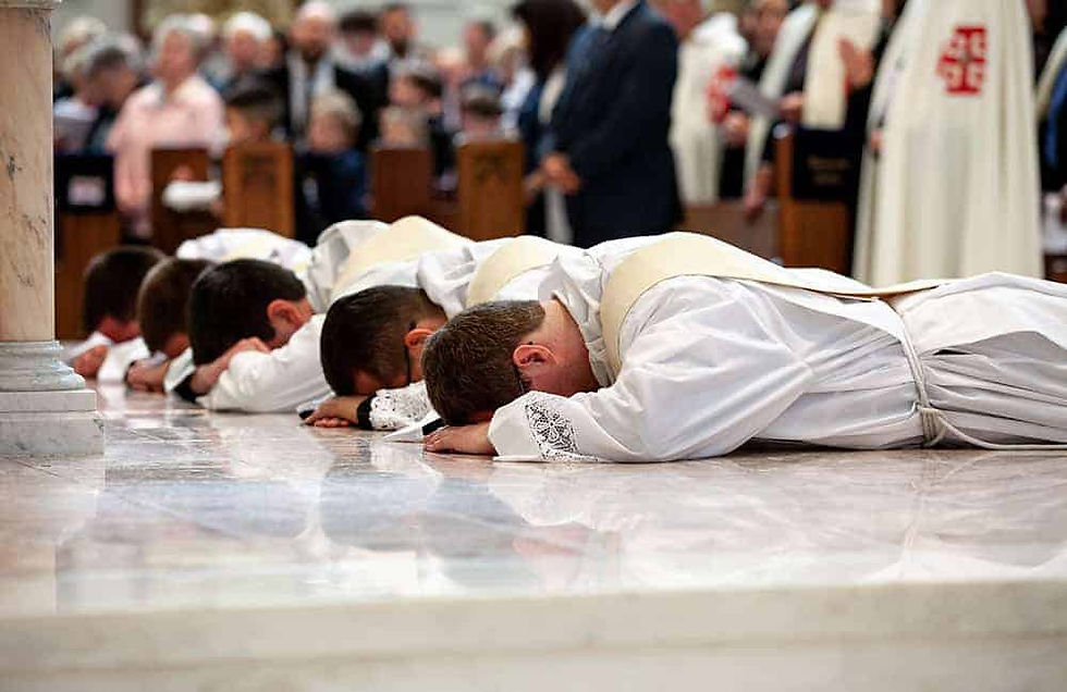 Priests laying prostrate in worship