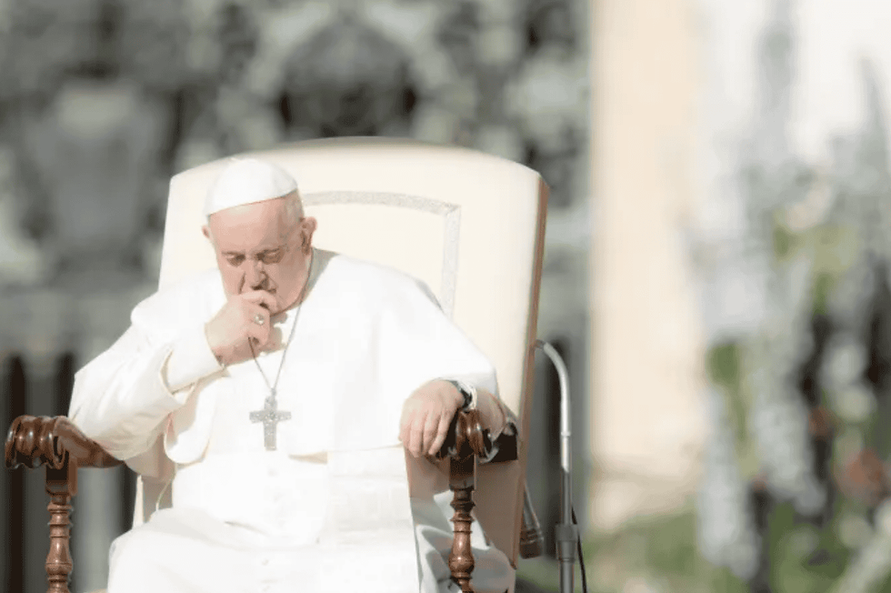 Pope Francis prays at his Wednesday audience in St. Peter's Square. (Photo by Daniel Ibáñez/CNA)