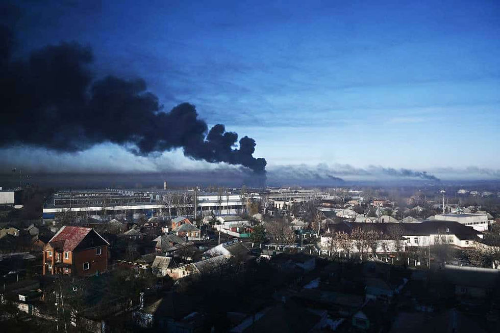 Black smoke rises from a military airport in Chuguyev near Kharkiv on February 24, 2022. - Russian President Vladimir Putin announced a military operation in Ukraine today with explosions heard soon after across the country and its foreign minister warning a "full-scale invasion" was underway. (Photo by Aris Messinis / AFP) (Photo by ARIS MESSINIS/AFP via Getty Images)