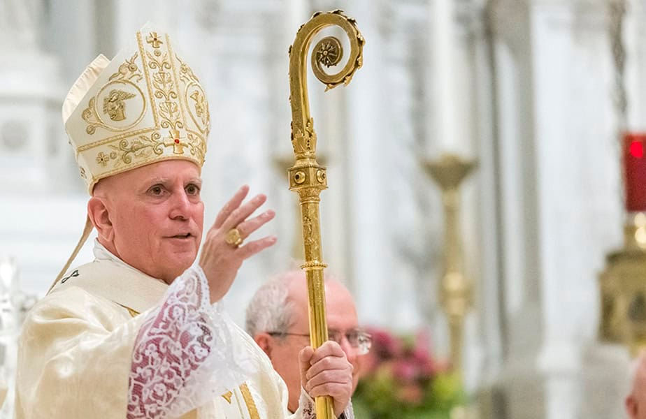 Archbishop Aquila holding a crosier