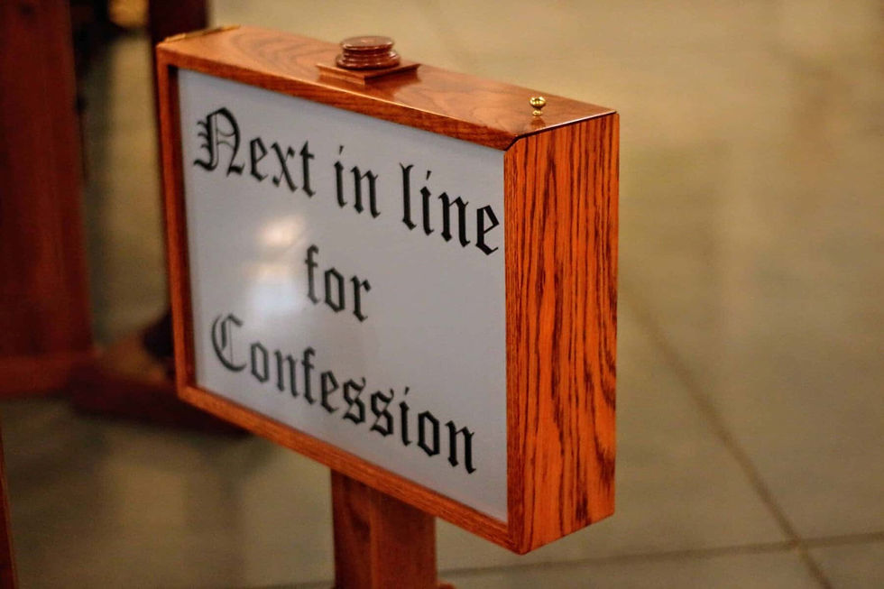 Sign reading "Next in line for Confession"