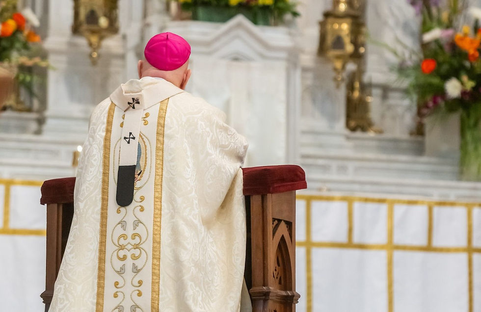 Archbishop Aquila kneeling before the altar