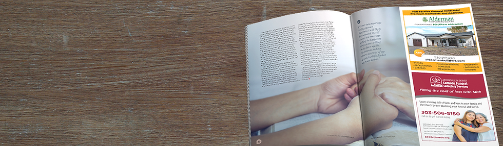 A Denver Catholic complimentary print edition is open, with two hands held in faith on the pages.
