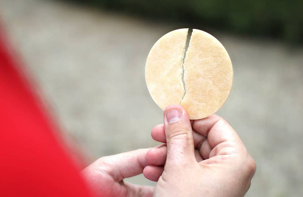 The Eucharist host broken down the middle