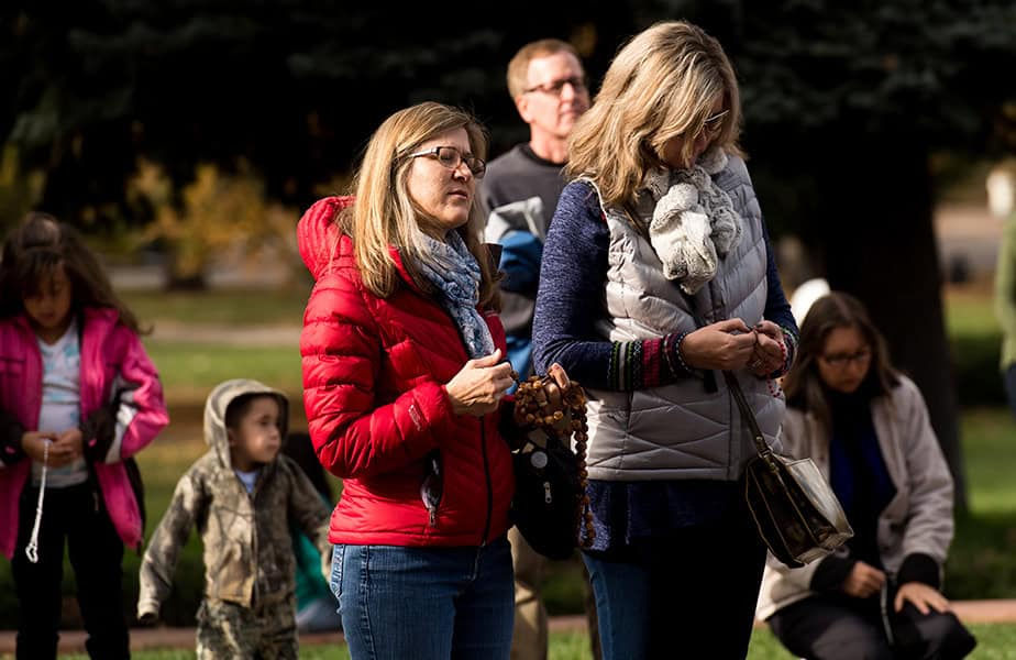 People pray during the quarterly Prayer in the Square event on the west steps of the Colorado State Capitol Building on November 5, 2016, in Denver, Colorado. The assembled prayed the Rosary and Divine Mercy Chaplet. (Photo by Anya Semenoff/Denver Catholic)