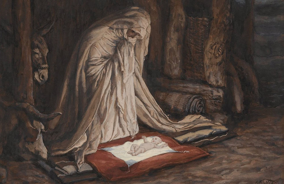 Mary looking at the baby Jesus in the stable