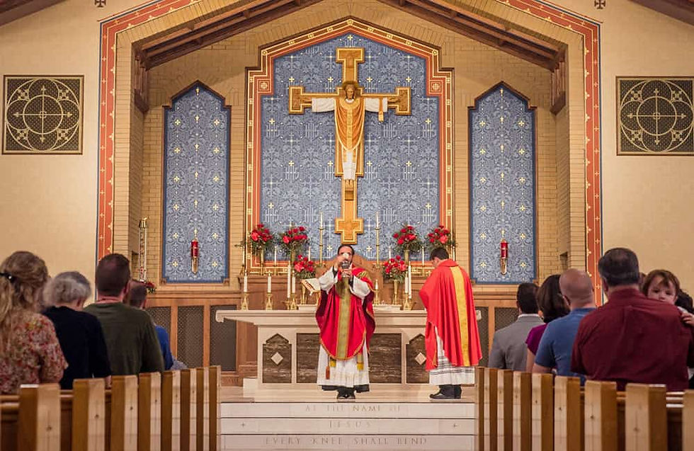 Priest celebrating Mass and holding up the Eucharist