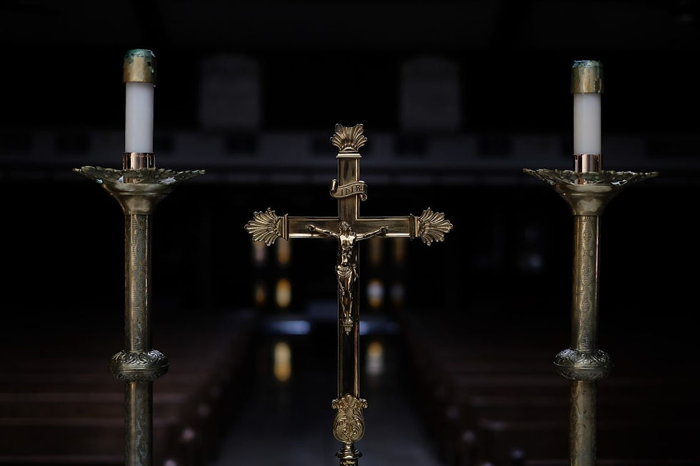 A crucifix and two candles