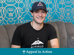 Man in a cap and "Buffalo" shirt smiles on a gray couch. Blue patterned wall behind. Text at bottom reads "Appeal in Action."