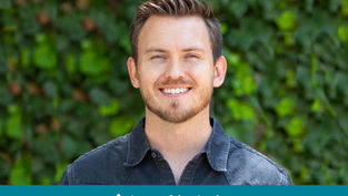 Smiling man in denim shirt with green leafy background. Text: "Appeal in Action" on bottom. Bright, cheerful mood.