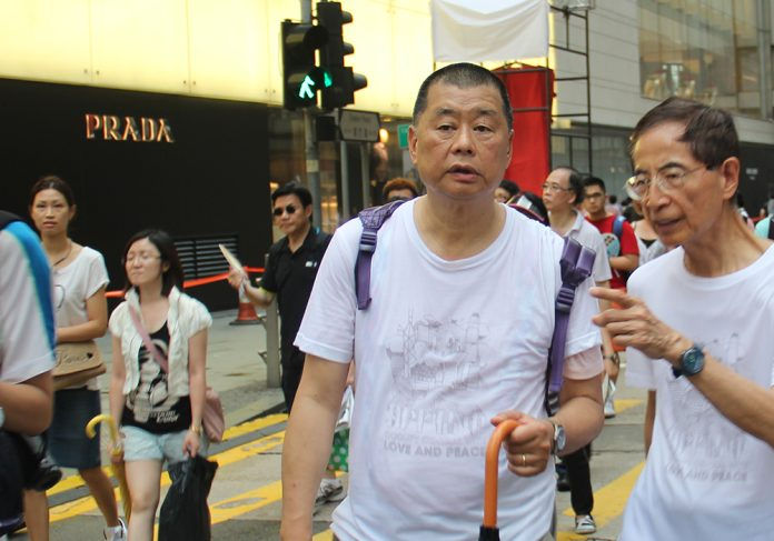 Jimmy Lai walking on the street