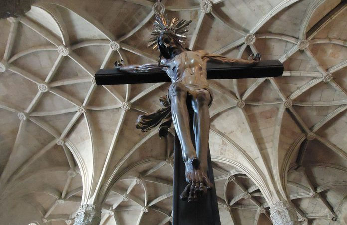 Looking up at a crucifix 