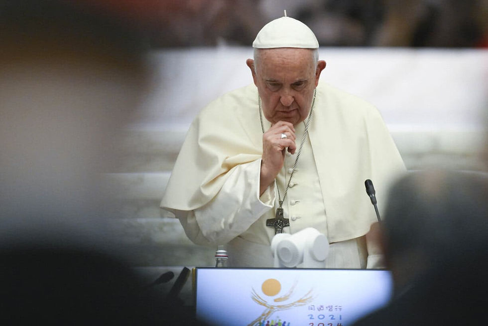 Pope Francis standing at a podium