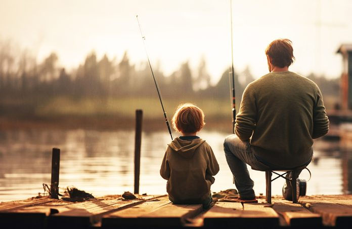 Man and his son fishing off of a dock