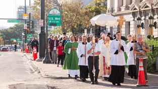 200 financial professionals process with Jesus through downtown Denver at conclusion of conference