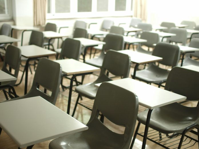 Desks and chairs in rows