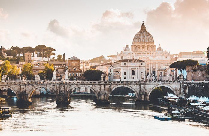 View of the Tiber river and St. Peter's Basilica