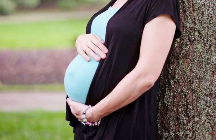 Donielle Wilde, of Greensboro, N.C., poses for a photo Oct. 1, while pregnant with her 10th child. Wilde recently discovered her breast cancer has metastasized to her ovaries but has opted not to have cancer treatment until after the baby is born. She and her husband, Keith, said they are relying on their Catholic faith to see them through her health struggles. (CNS file photo/courtesy Catholic News Herald) See LIFE-COUPLE to come.