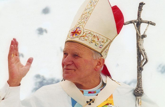 Pope John Paul II with hand raised