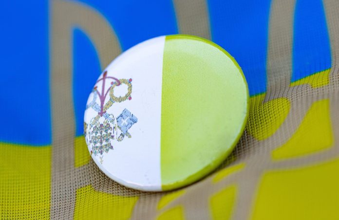 Vatican pin on top of Ukraine flag