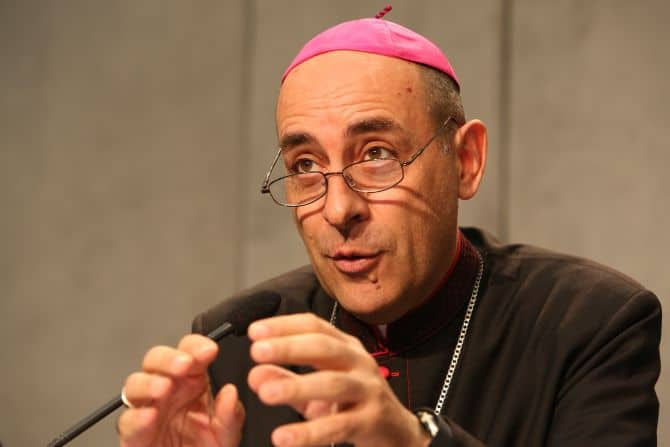 Archbishop Fernández speaking into a microphone