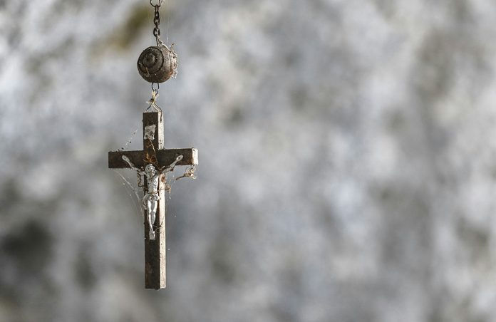 A crucifix on the end of a rosary