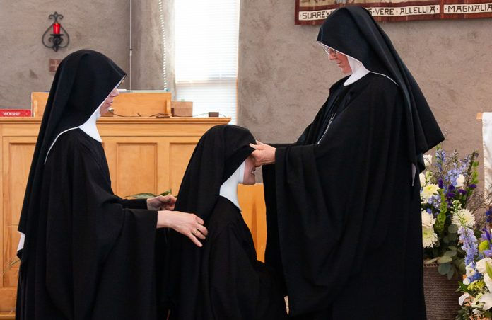 Sister Maria of Jesus (center) of the Abbey of St. Walburga made her solemn monastic profession on Feb. 10, the feast of St. Scholastica. (Photo by André Escaleira, Jr.)