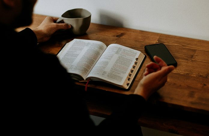 Person reading a Bible