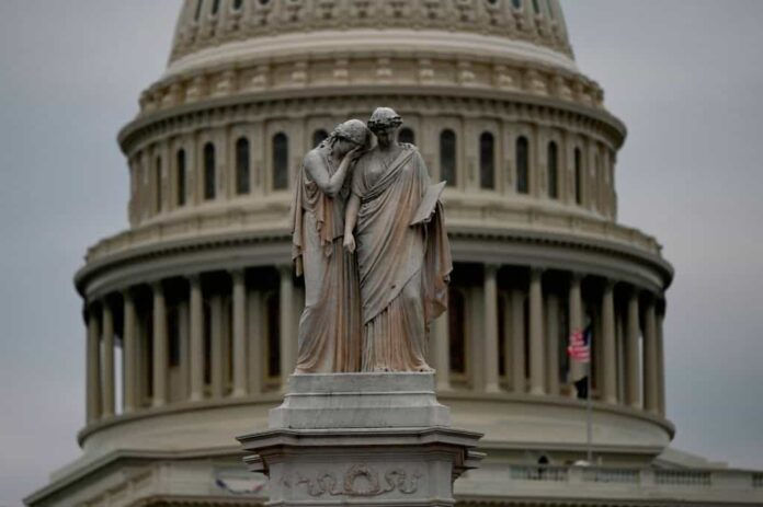 TOPSHOT - The Peace Monument memorial is seen in front of the US Capitol on January 6, 2021, in Washington, DC. - Donald Trump's supporters stormed a session of Congress held today, January 6, to certify Joe Biden's election win, triggering unprecedented chaos and violence at the heart of American democracy and accusations the president was attempting a coup. (Photo by ANDREW CABALLERO-REYNOLDS/AFP via Getty Images)