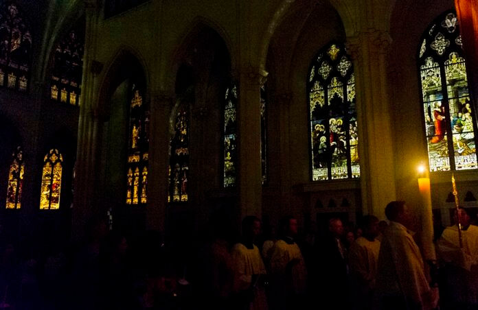 DENVER, CO - APRIL 19: The eternal candle processes through the church during the Easter Vigil Mass at the Cathedral Basilica of the Immaculate Conception on April 19, 2014, in Denver, Colorado. (Photo by Daniel Petty/Denver Catholic Register)