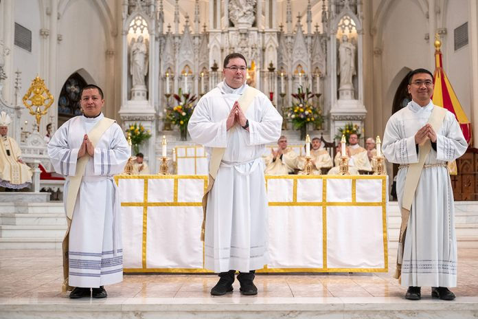 From L-R, Deacon Patricio Chuquimarca, Deacon Kevin Kasel and Deacon Anthony Phan look on during their priest ordination at the Cathedral Basilica of the Immaculate Conception on May 13, 2023, in Denver, Colorado. (Photo by Daniel Petty/Denver Catholic)