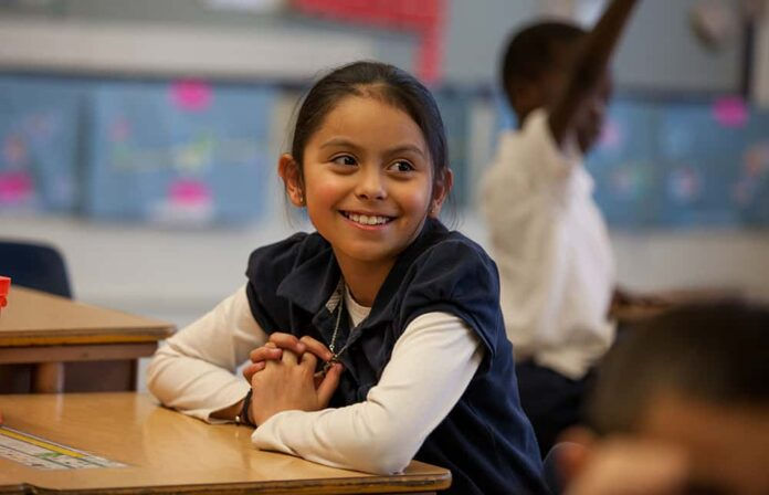 Girl sitting at a desk in school