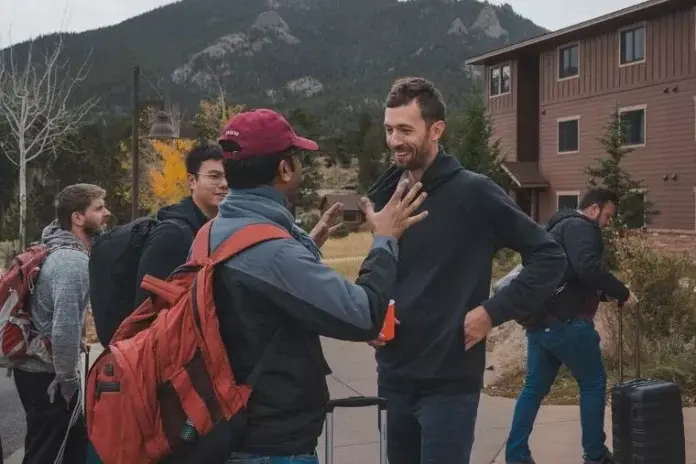 An Exodus 90 participant (c) talks to Exodus founder and chief executive officer Jamie Baxter (r) at the at the 2023 Exodus Summit in Estes Park, Colorado. (photo: National Catholic Register / Exodus photography crew)