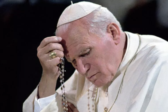 In this undated photo, Pope St. John Paul II is seen praying the Rosary. (photo: Vatican Media / CNA)